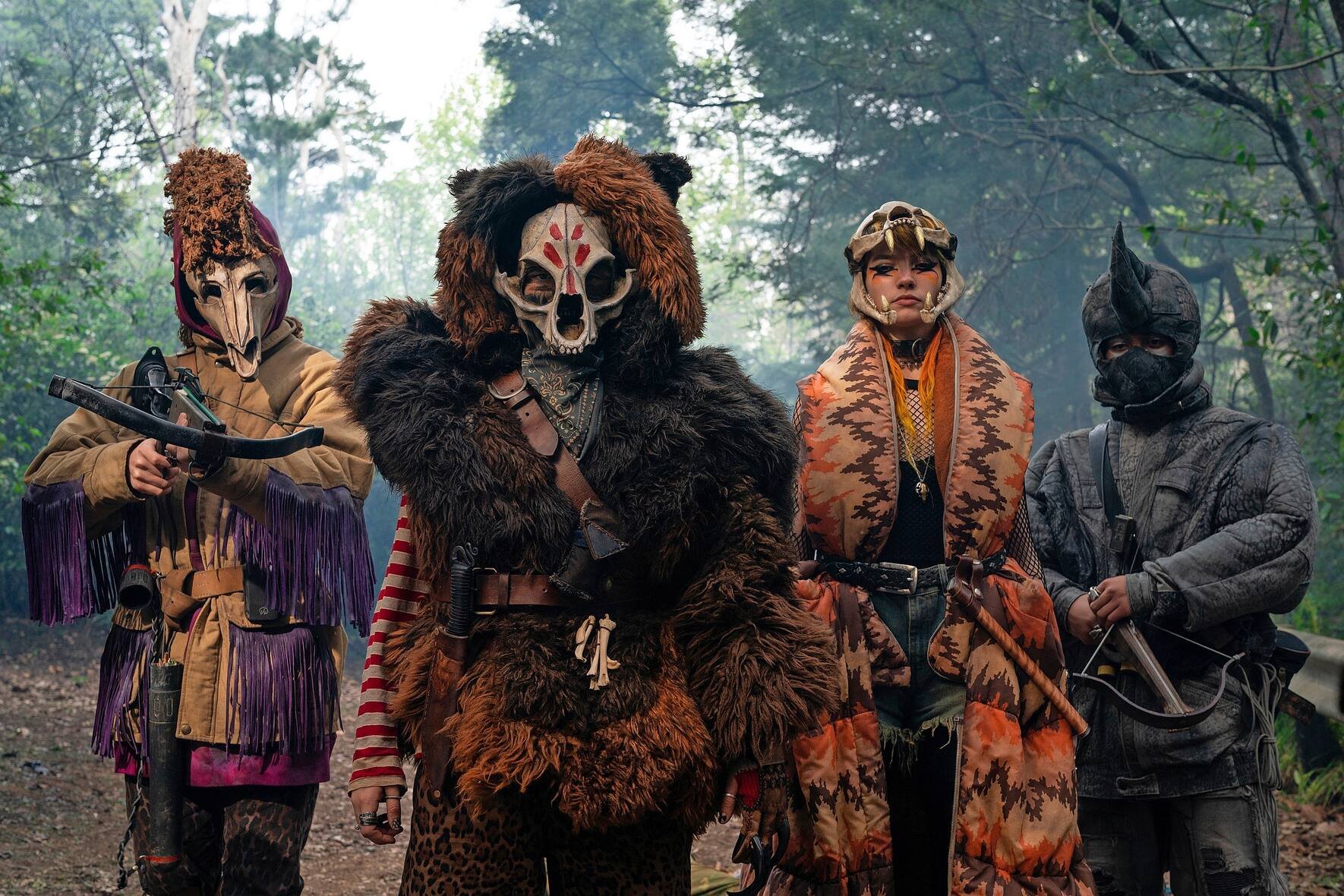 SWEET TOOTH (L to R) ANIMAL ARMY MEMBER, STEFANIA LAVIE OWEN as BECKY, MIA ARTEMIS as TIGER and ANIMAL ARMY MEMBER in episode 103 of SWEET TOOTH Cr. KIRSTY GRIFFIN/NETFLIX Â© 2021